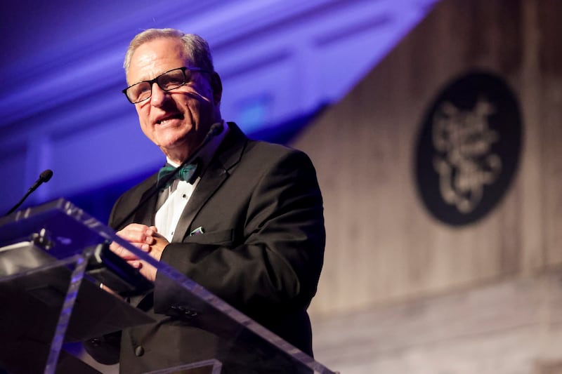 Ray Pickup, former CEO of WCF Insurance, speaks as he is honored with the 43rd Giant in our City award in Salt Lake City.