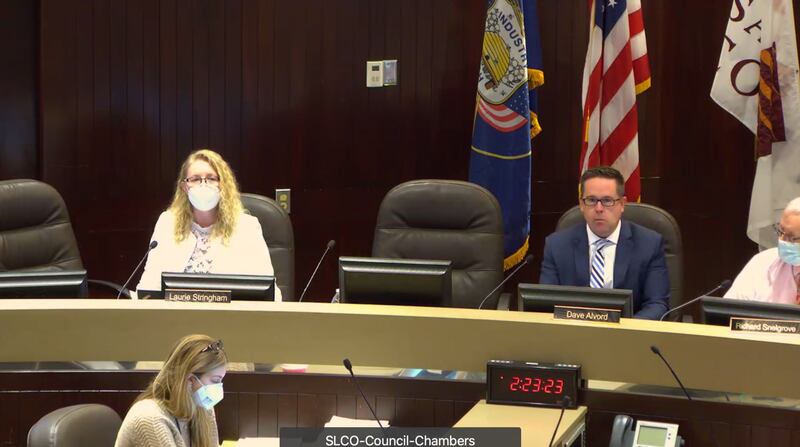 Salt Lake County Council Chairwoman Laurie Stringham, left, and Salt Lake County Councilman Dave Alvord, right, sit together in the Salt Lake County Council Chambers on Tuesday, Jan. 11, 2022, during a public hearing on the county’s mask mandate.