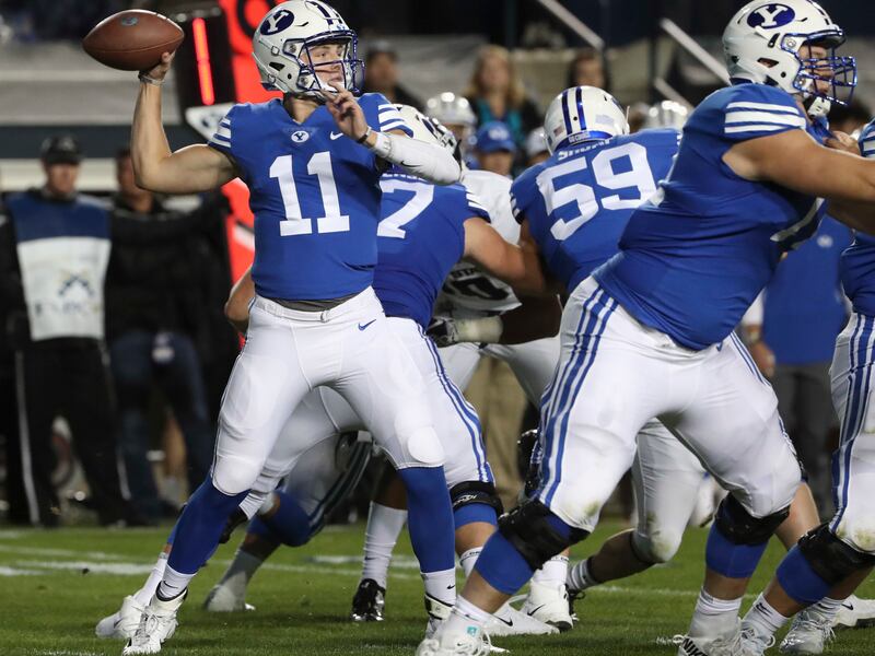 Brigham Young Cougars quarterback Zach Wilson (11) fires a pass late in the fourth quarter of the Utah State versus BYU football game at LaVell Edwards Stadium in Provo on Friday, Oct. 5, 2018.