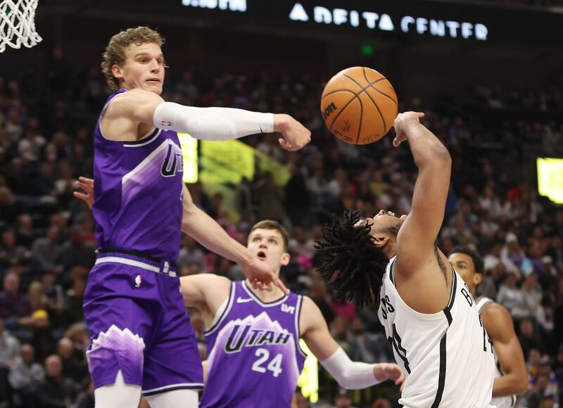 Utah Jazz forward Lauri Markkanen blocks the shot by Brooklyn Nets guard Cam Thomas in Salt Lake City on Monday, Dec. 18, 2023.