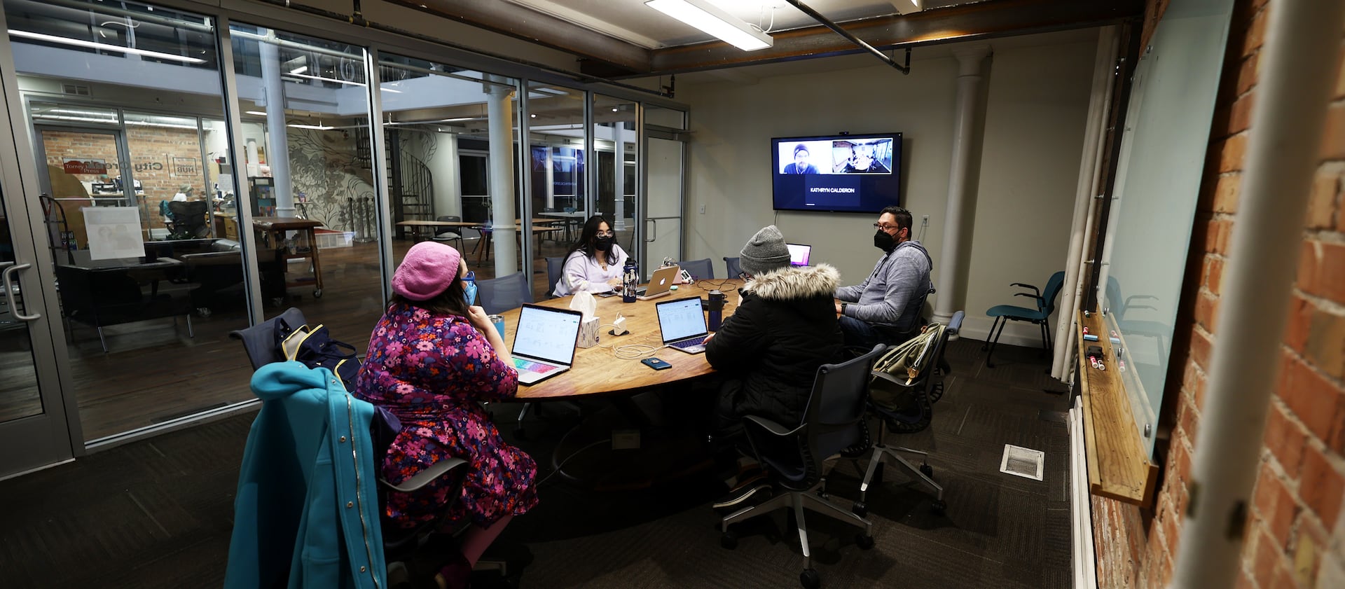 Workers from small companies work at co-working space Impact Hub in Salt Lake City on Tuesday, Dec. 14, 2021.
