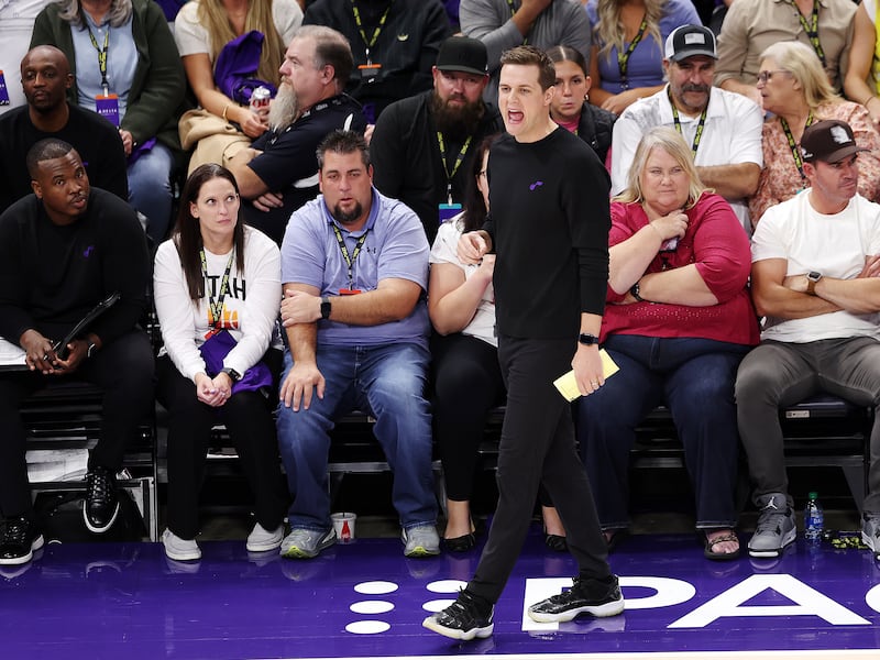 Utah Jazz head coach Will Hardy, wearing black, calls out instructions