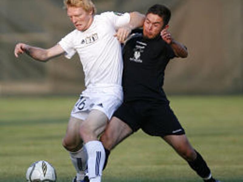 BYU's Andrew Van Wagenen, left, and Ogden's Kenneth Hickman battle for the ball in Saturday's game at South Field in Provo.