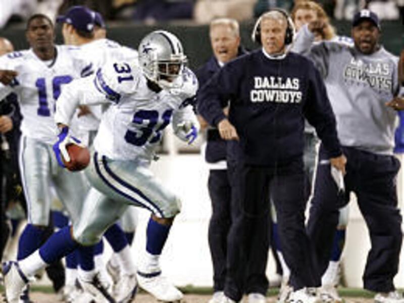 Dallas' Roy Williams returns an interception for the game-winning touchdown in the fourth quarter Monday.