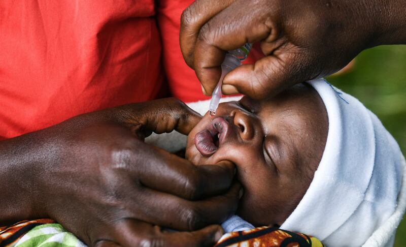 A baby receives an oral polio vaccine during the Malawi Polio Vaccination Campaign Launch in Lilongwe, Malawi.