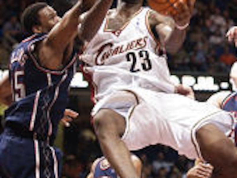 Cleveland Cavaliers' LeBron James rises for a shot, defended by New Jersey Nets' Jason Collins, in third quarter of Cavs' win Saturday.