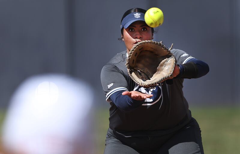 BYU’s Huntyr Ava watches ball into her glove at first base during a softball game against Iowa State in Provo.