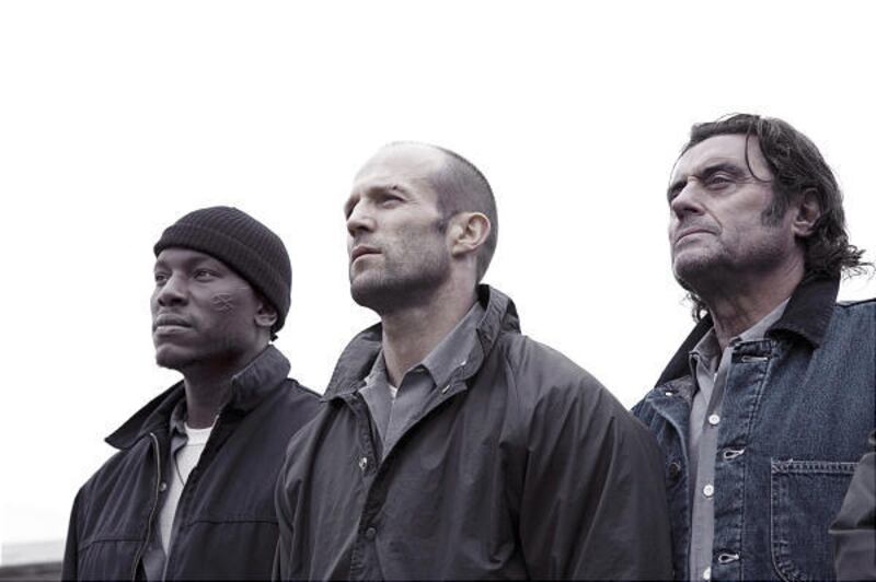 Tyrese Gibson, left, Jason Statham and Ian McShane in the action-thriller "Death Race," which features laughably awful dialogue and performances.