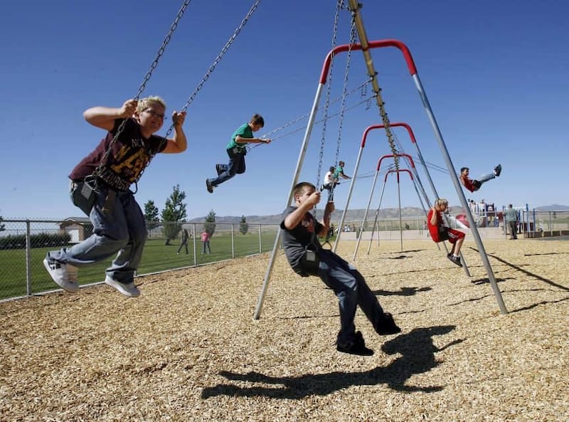 Students swing during lunch recess, Thursday, Sept. 29, 2011.