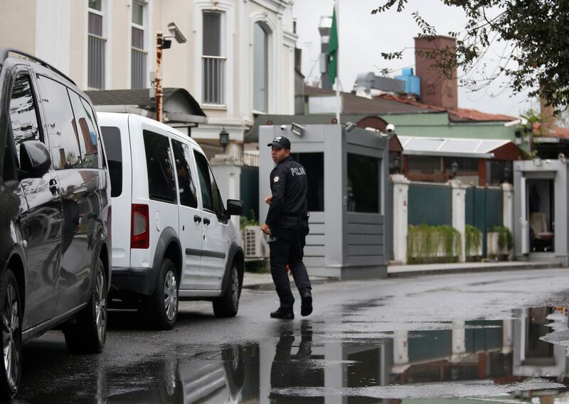 A Turkish police officer walks outside the Saudi Arabia consul general residence in Istanbul, Thursday, Oct. 18, 2018.