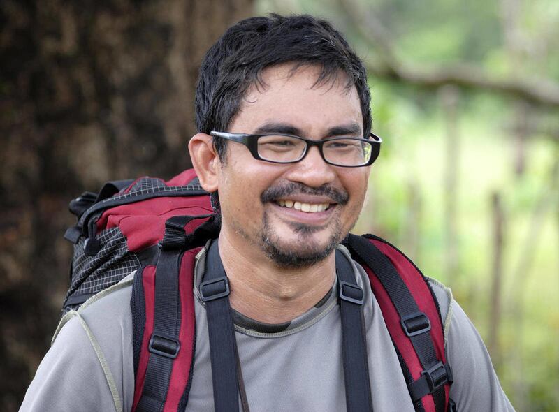 In this photo taken on April 19, 2011, Filipino wildlife photographer Ivan Sarenas goes mountain-hiking in Palanan, Isabela northeast of the Philippines. Sarenas, who was seized with Swiss and Dutch tourists Wednesday, Feb. 1, 2012, during a bird-watching