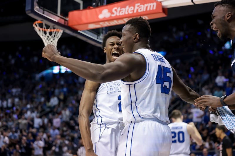 BYU Cougars Jaxson Robinson (2) and Fousseyni Traore (45) celebrate after Traore dunked during the game against Gonzaga.
