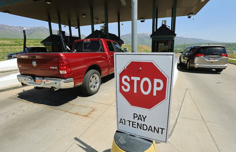 Motorists stop at the toll booth at Adams Avenue Parkway in Washington Terrace on Thursday. Utah officials are looking at ways to increase transportation funding.