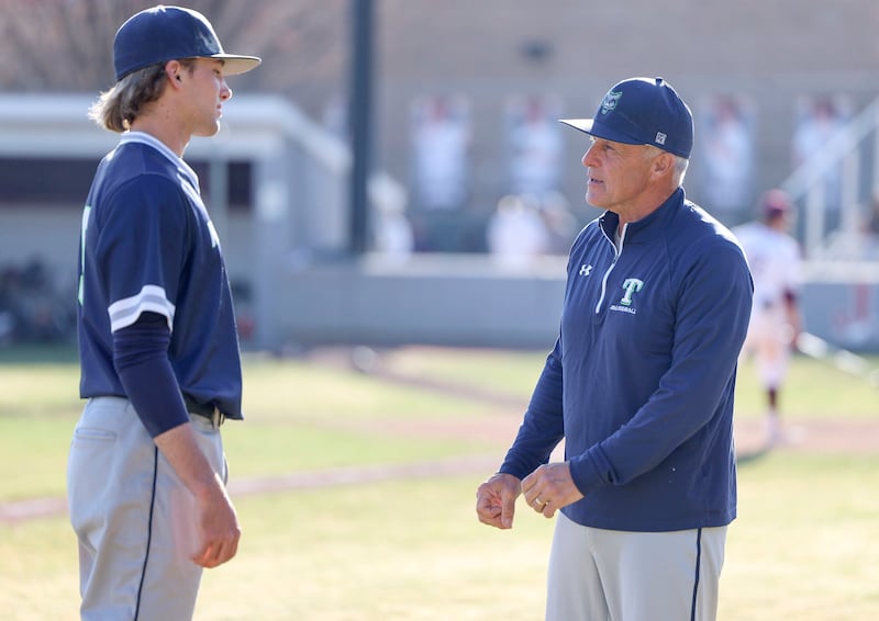 Timpanogos baseball coach Kim Nelson speaks with Dakoda West after a game against Jordan at Jordan High School in Sandy.