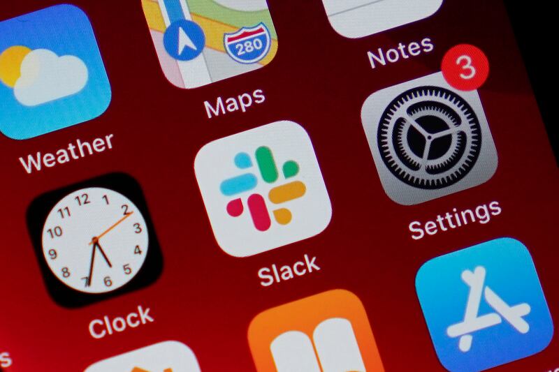 The Slack app icon on an iPhone screen.