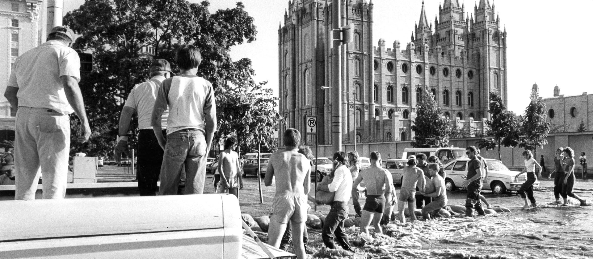 Volunteers build a temporary dike along Main Street near the Salt Lake Temple.
