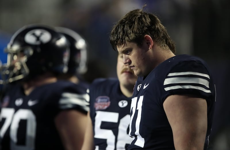 BYU players watch the final seconds tick off the clock during loss to UAB in the Independence Bowl on Dec. 18, 2021.