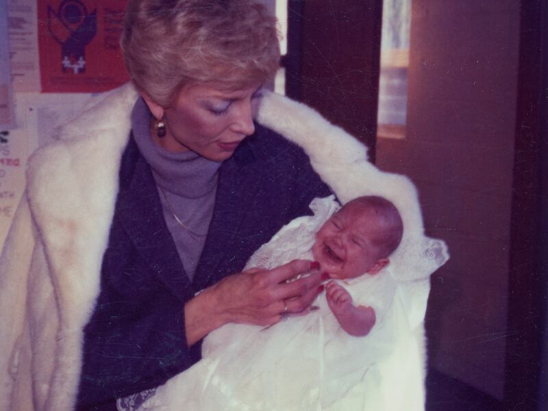 Joyce Yost holds one of her newborn granddaughters