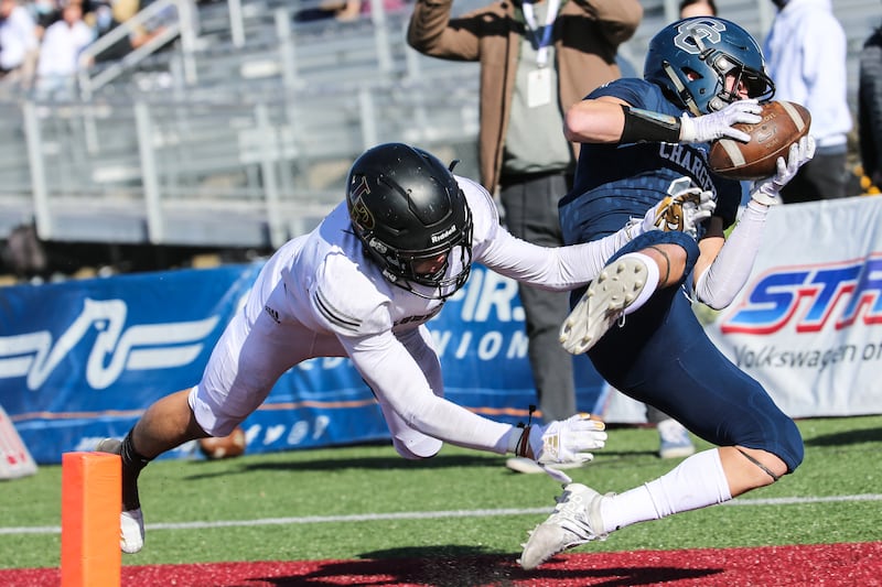 Corner Canyon’s Cody Hagen (3) runs the ball and dives into the end zone for a touchdown in the 6A football state championship game.