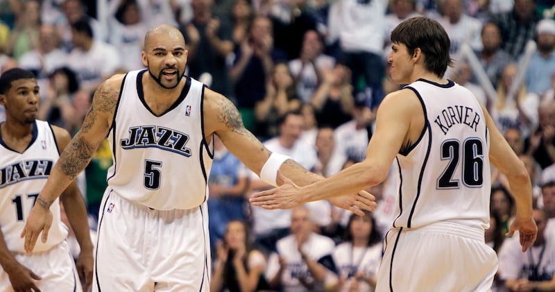Carlos Boozer (left) congratulates Kyle Korver after a 3-point-shot as the Utah Jazz and the Los Angeles Lakers play in game 3 the the NBA Western Conference semi-finals Saturday, May 8, 2010 in Salt Lake City, Utah. Tom Smart, Deseret News
