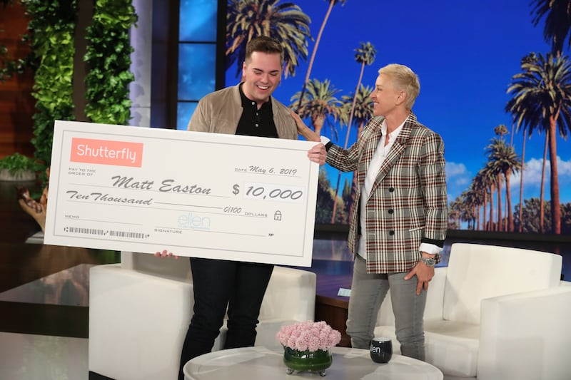 BYU graduate Matt Easton accepts a $10,000 gift from talk show host Ellen DeGeneres during a taping of “The Ellen DeGeneres Show” at the Warner Bros.’ lot in Burbank, Calif.