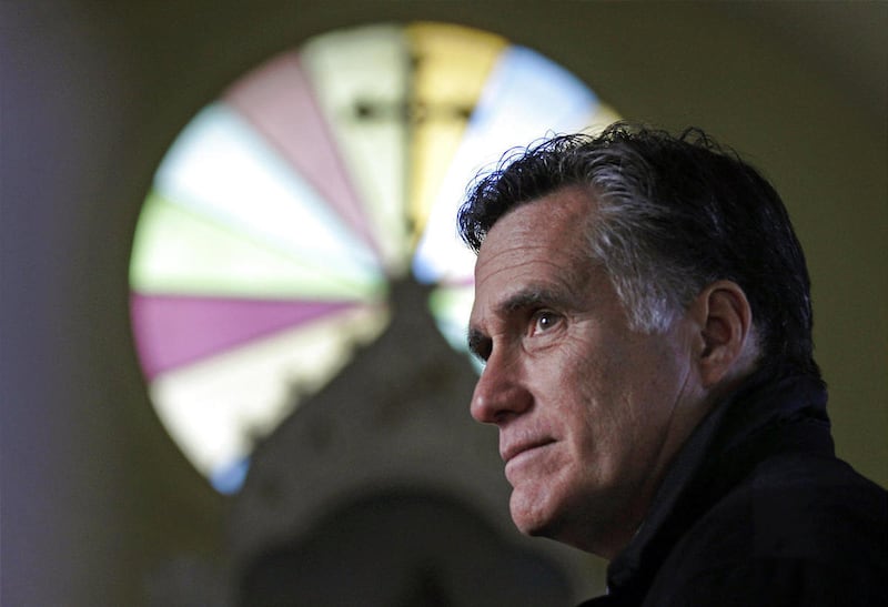 In this Thursday Dec. 22, 2011 file photo, Republican presidential candidate, former Mass. Gov. Mitt Romney, visits St. Paul's Lutheran Church while campaigning in Berlin, N.H.