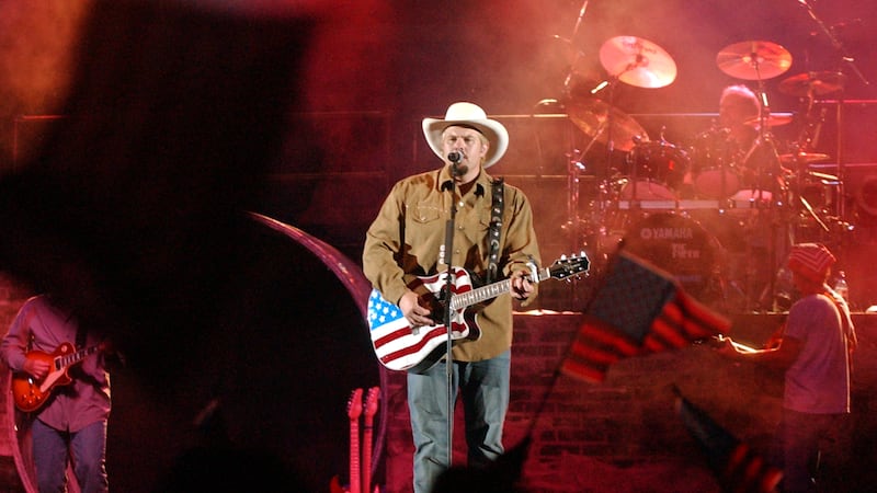 Toby Keith performs “Angry American” in LaVell Edwards Stadium during the Stadium of Fire in Provo on Thursday, July 4, 2002.