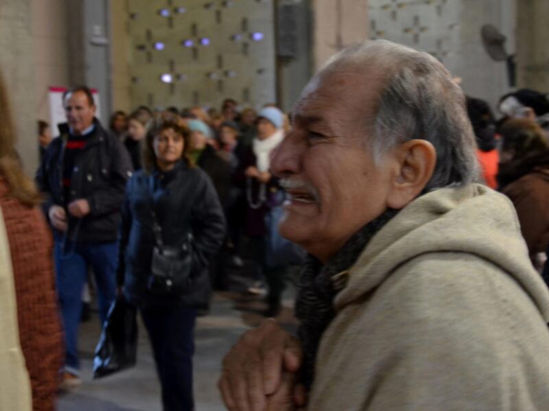 Catholic pilgrims are regularly overcome with emotion at the Shrine of Our Lady of the Rosary of San Nicolas, as this man was while visiting it on July 25, 2016, in San Nicolas de Arroyos, Argentina.