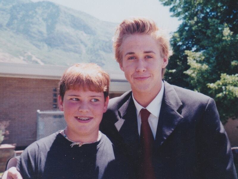Jamie Robinson posing next to Ryan Gosling outside of the Provo Missionary Training Center.
