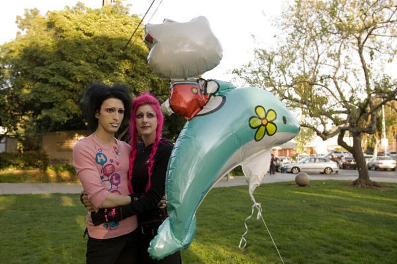 Kynt Cothron, left, and Vyxsin Fiala hold a vigil for Larry King, 15, an Oxnard student who was declared brain dead on Wednesday in West Los Angeles. Several students at the south Oxnard campus said King and his alleged assailant had a falling out stemmin