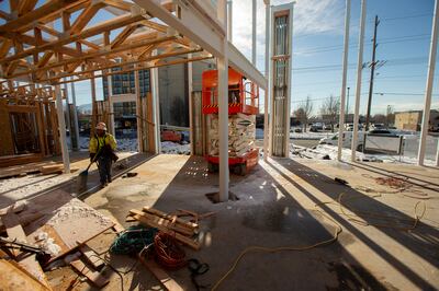 FILE - Construction workers work at the Garden Lofts, an affordable housing project being built in Salt Lake City, on Friday, Dec. 28, 2018.