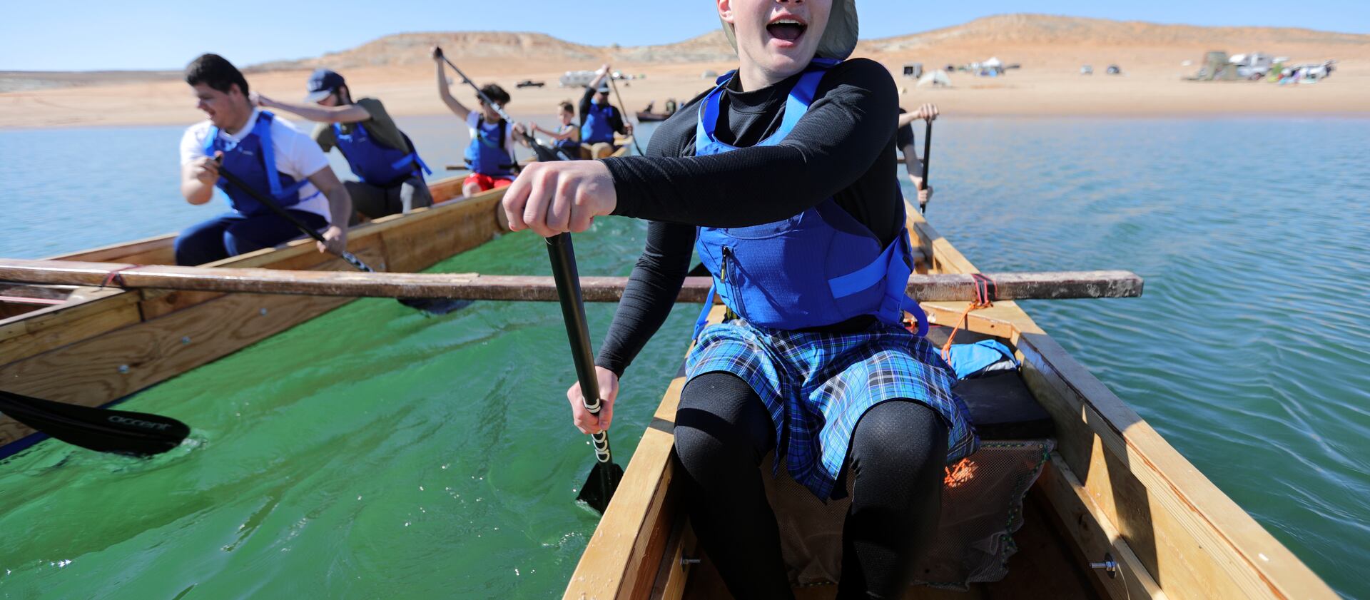 Landon Pearce, a visually impaired 10th grader at the Utah Schools for the Deaf and the Blind, paddles with his team on Lake Powell.