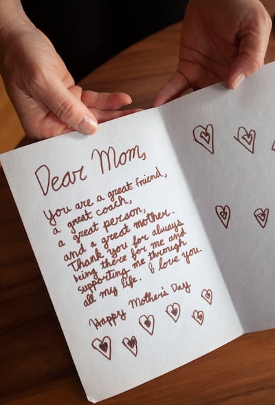 Jill McCluskey displays her Mother's Day card from her daughter Lauren on Friday, May 24, 2019, at their home in Pullman, Wash. Lauren McCluskey was murdered in October of 2018 on the University of Utah campus.