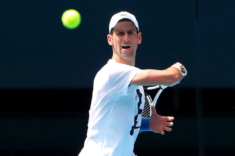 Serbia’s Novak Djokovic plays a forehand return.
