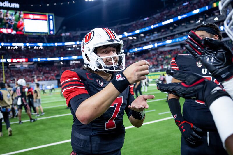 Utah Utes quarterback Cameron Rising mimics sipping tea