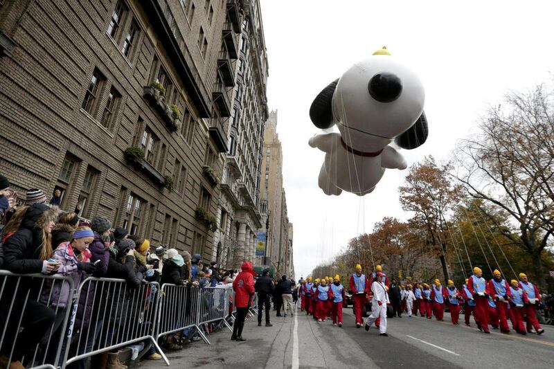 Snoopy hovers over Central Park West during the Macy’s Thanksgiving Day Parade, Thursday, Nov. 27, 2014, in New York.