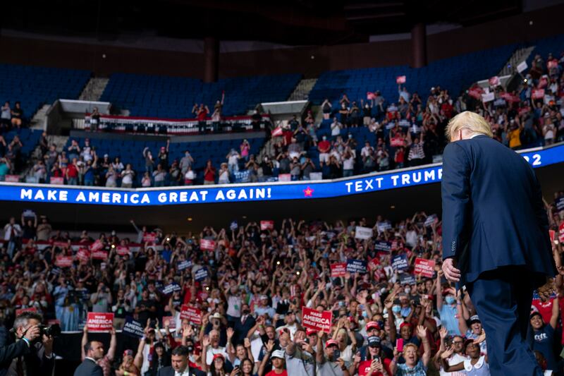 President Donald Trump arrives on stage to speak at a campaign rally at the BOK Center, Saturday, June 20, 2020, in Tulsa, Okla.