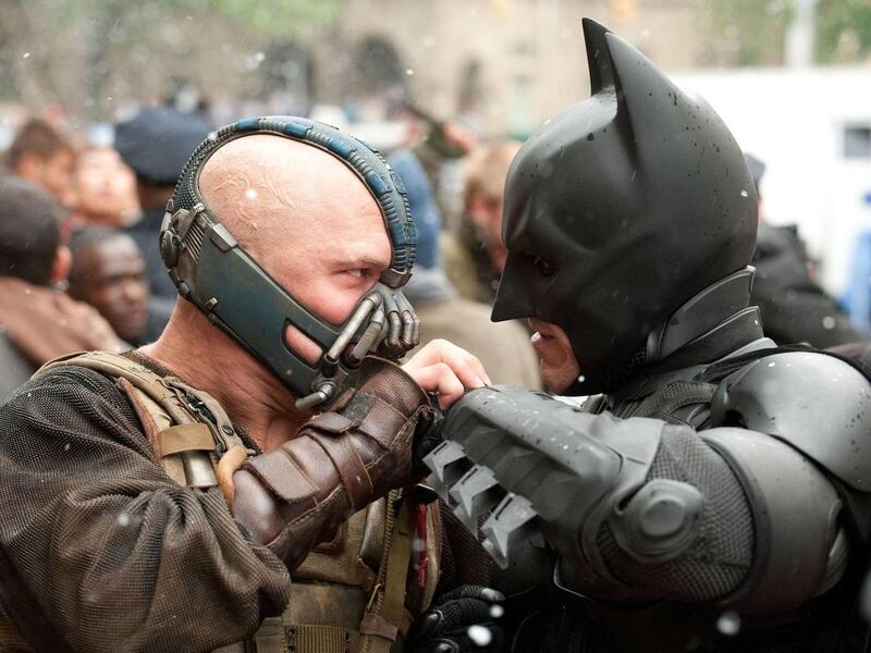 Tom Hardy as Bane and Christian Bale as Batman in "The Dark Knight Rises."