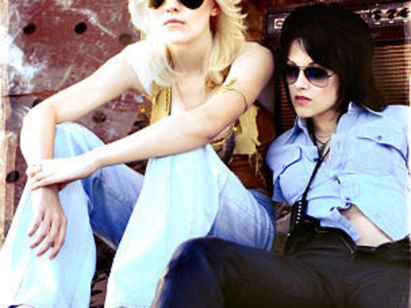 Dakota Fanning, left, and Kristen Stewart in a scene from the predictable "The Runaways."