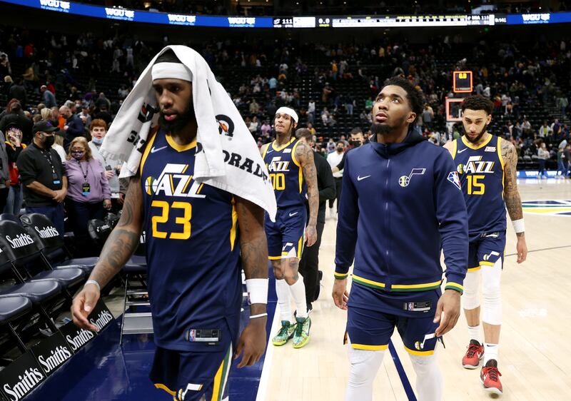 Utah Jazz forward Royce O’Neale (23), Utah Jazz guard Donovan Mitchell (45), Utah Jazz guard Jordan Clarkson (00) and Utah Jazz guard Denzel Valentine (15) walk off the floor.