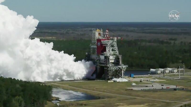 In this image from video made available by NASA, the core stage of the Space Launch System, NASA’s planned moon rocket, is tested at the Stennis Space Center near Bay St. Louis, Miss., on Thursday, Mar. 18, 2021.