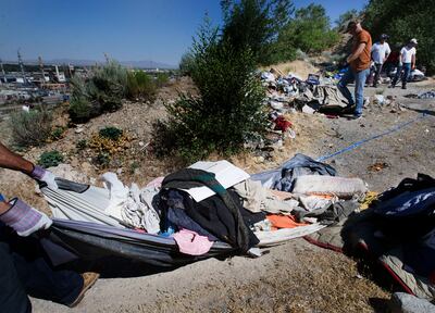 Following reports of illegal camping, excessive litter and human waste, crews with multiple agencies clear out homeless camps located east of Victory Road in the foothills north of Salt Lake City on Thursday, June 14, 2018.