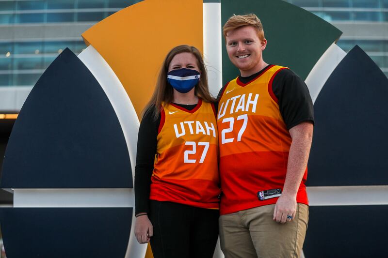 Jazz fans Halston Brown, left, and James Robinson pose for a photo before a Jazz game at Vivint Smart Home Arena in Salt Lake City on April 8.