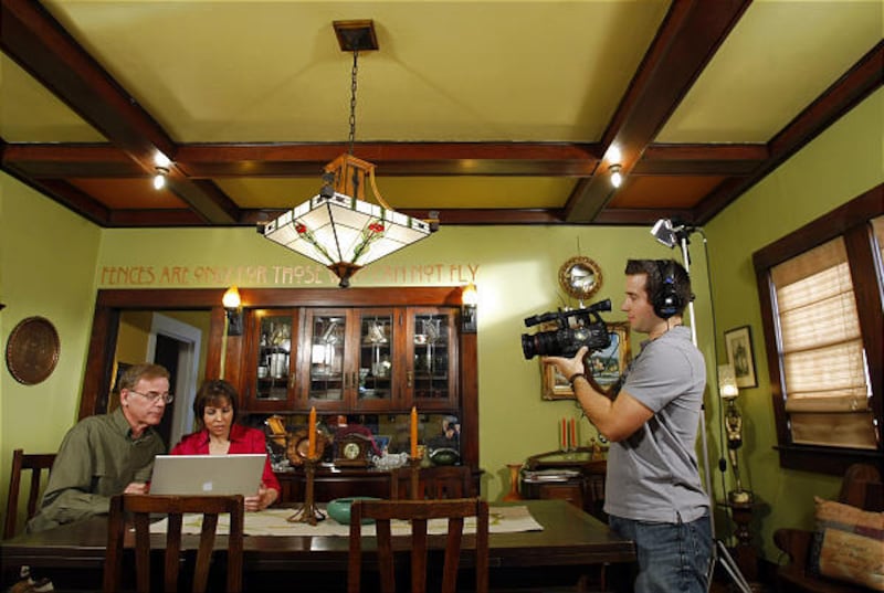 Eric and Stacy Luecker, left, are videotaped by producer Dan Coffey for "Rate My Space."