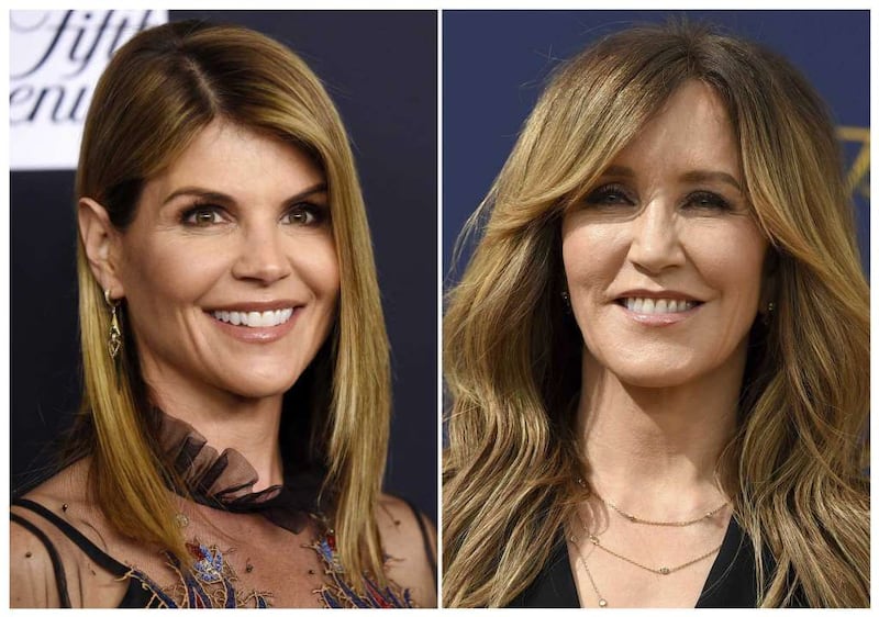 This combination photo shows actress Lori Loughlin in Beverly Hills, Calif., on Feb. 27, 2018, left, and actress Felicity Huffman at the Emmy Awards in Los Angeles on Sept. 17, 2018. Loughlin and Huffman are among 33 parents indicted in a sweeping college