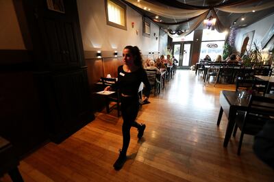 Karina Daghlian, daughter of Raffi and Marlen Daghlian, owners of Cedars of Lebanon in Salt Lake City, heads back to the kitchen with a food order on Friday, May 24, 2019. The restaurant is preparing to close after 38 years in business.