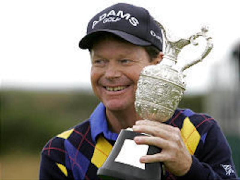 Tom Watson holds his trophy after winning the Senior British Open.