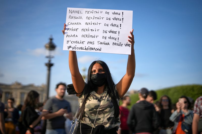 Youths gather on Concorde square during a protest in Paris, France.