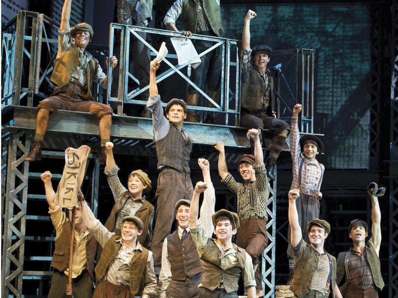 In this theater image released by Disney Theatricals, the cast of The Paper Mill Playhouse Production of "Newsies," starring Jeremy Jordan, background center, is shown in New York.
