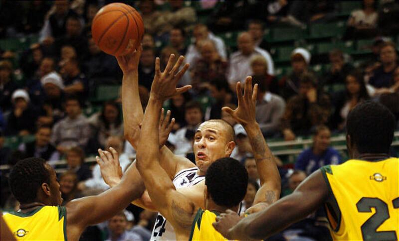 BYU's Jonathan Tavernari looks to make a pass over a wall of San Francisco players.